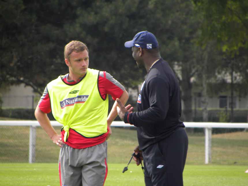 Dean Parrett chats to Head Coach Noel Blake at training.